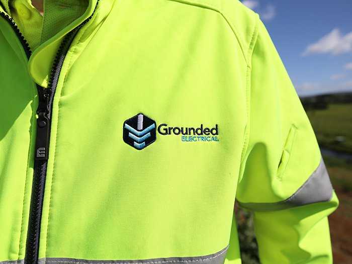 grounded logo on high vis-700x525.jpg